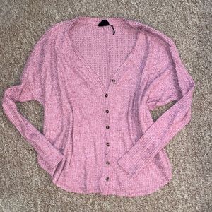 Out from under cardigan sweater